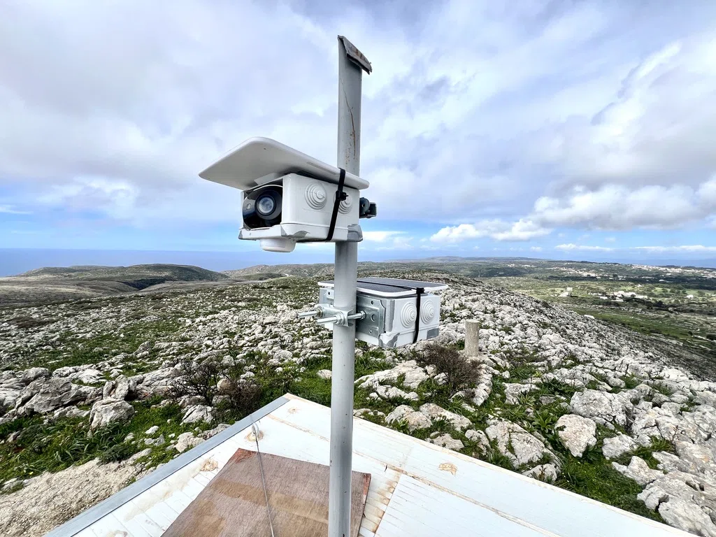 A fire monitoring camera on a mast above the rocky Kytherian landscape