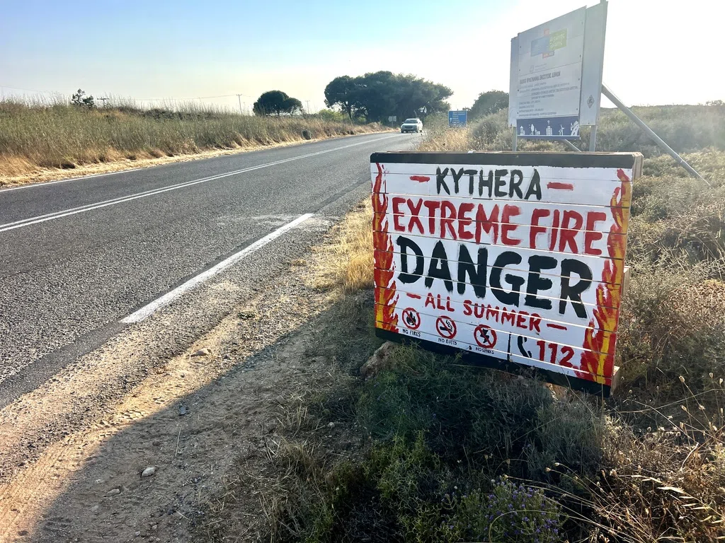 A handmade English extreme fire danger sign beside a Kythera road